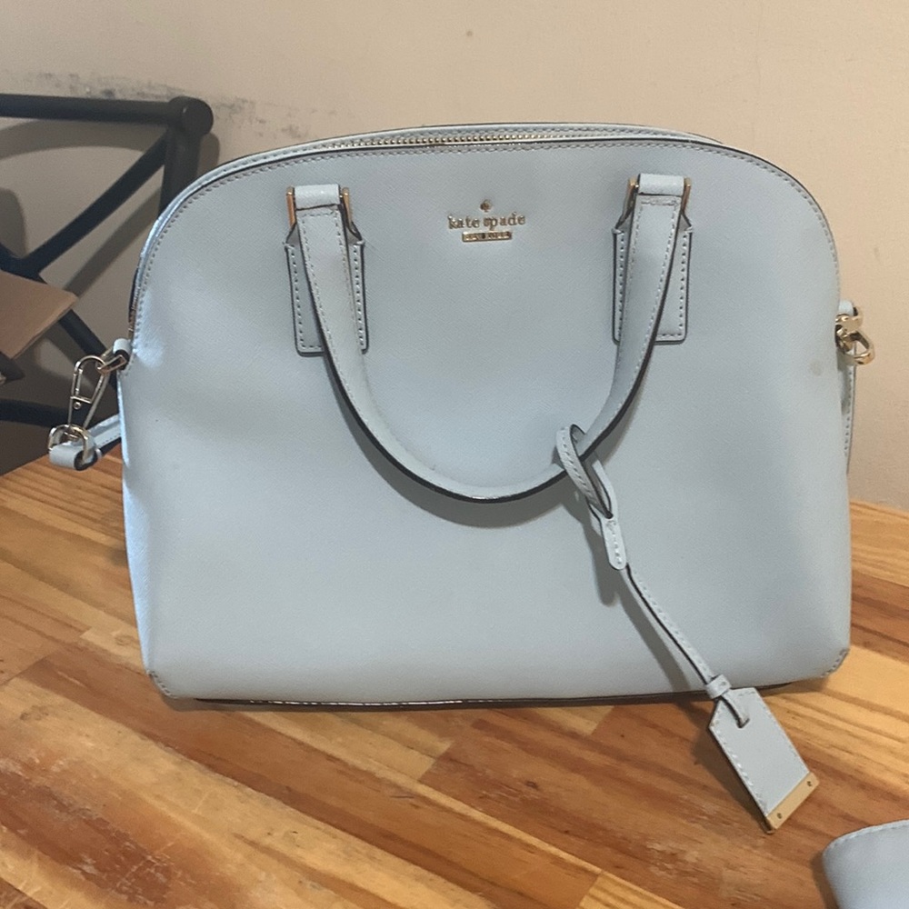 Beautiful pale blue kate spade bag with or without medium wristlet